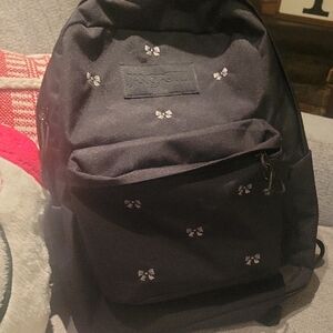 JanSport Black Backpack with White Bow Details